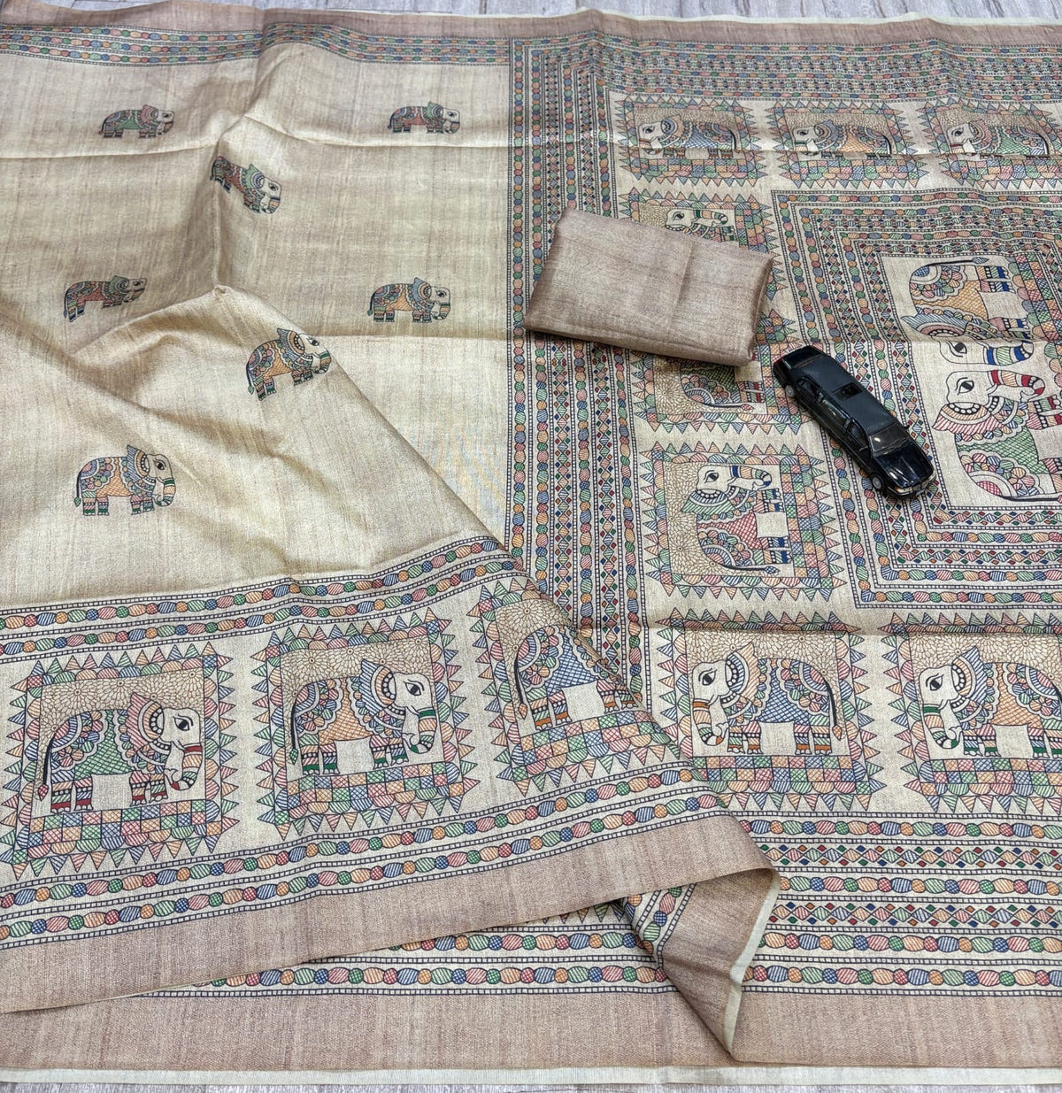 Cream Beige Silk Blend Saree with Multicolour Elephant Motifs, Decorative Pallu and Running Blouse for Festive Wear