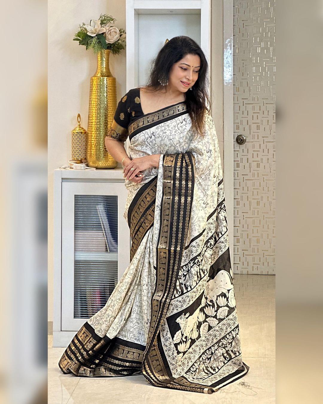 Heavy butter dola silk fabric with golden Dolby jacquard border and discharge padding leaf print - Swaraas