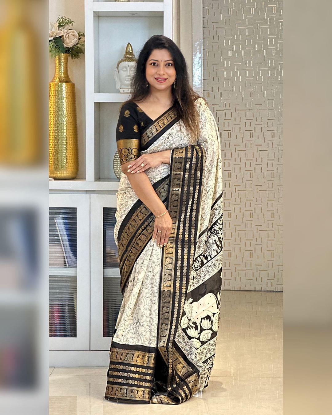 Heavy butter dola silk fabric with golden Dolby jacquard border and discharge padding leaf print - Swaraas