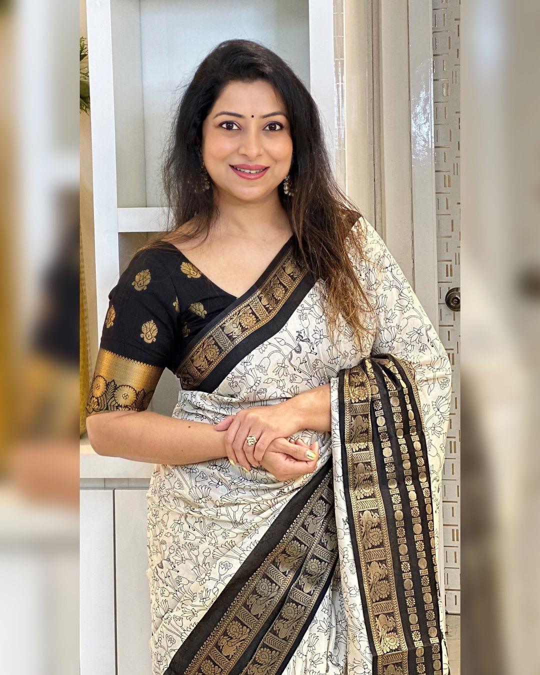 Heavy butter dola silk fabric with golden Dolby jacquard border and discharge padding leaf print - Swaraas