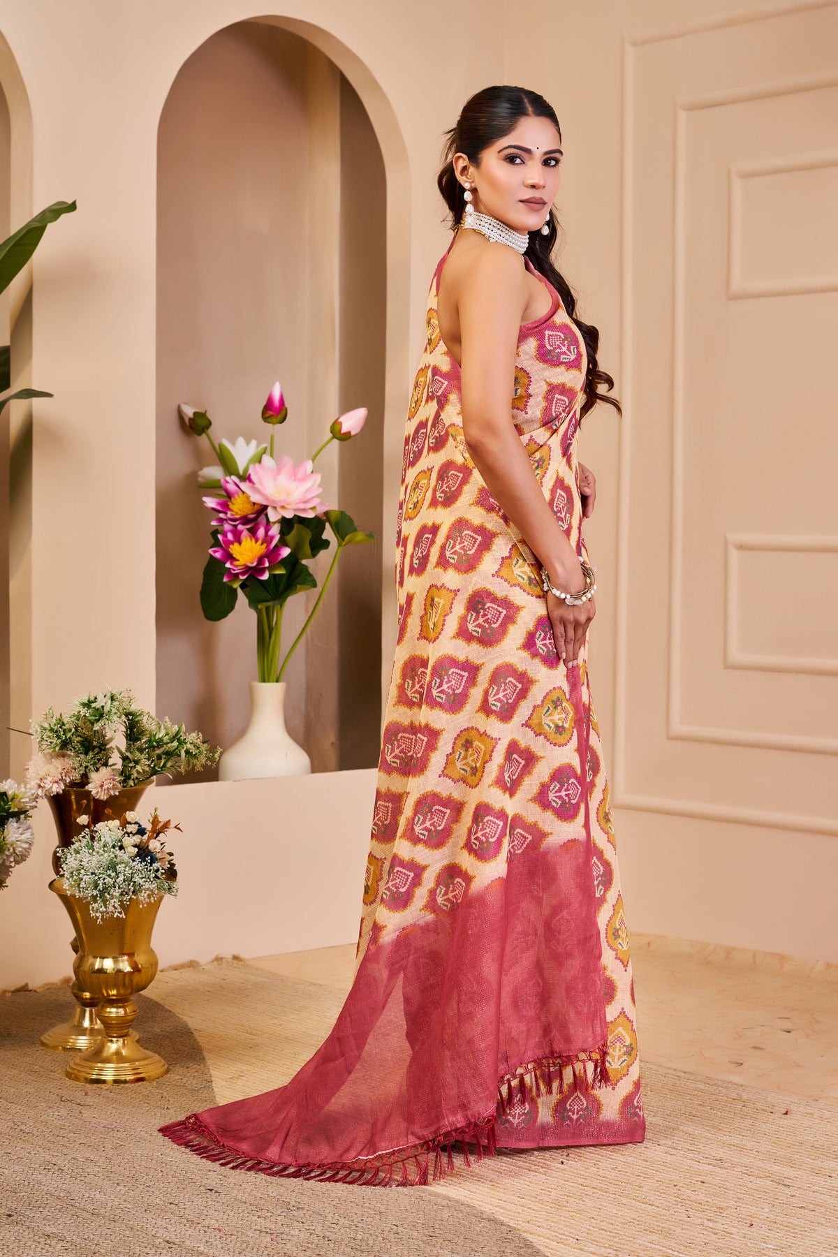 Cream and Rose Pink Tissue Silk Saree with Floral Motifs, Tasselled Pallu and Running Blouse for Festive Wear
