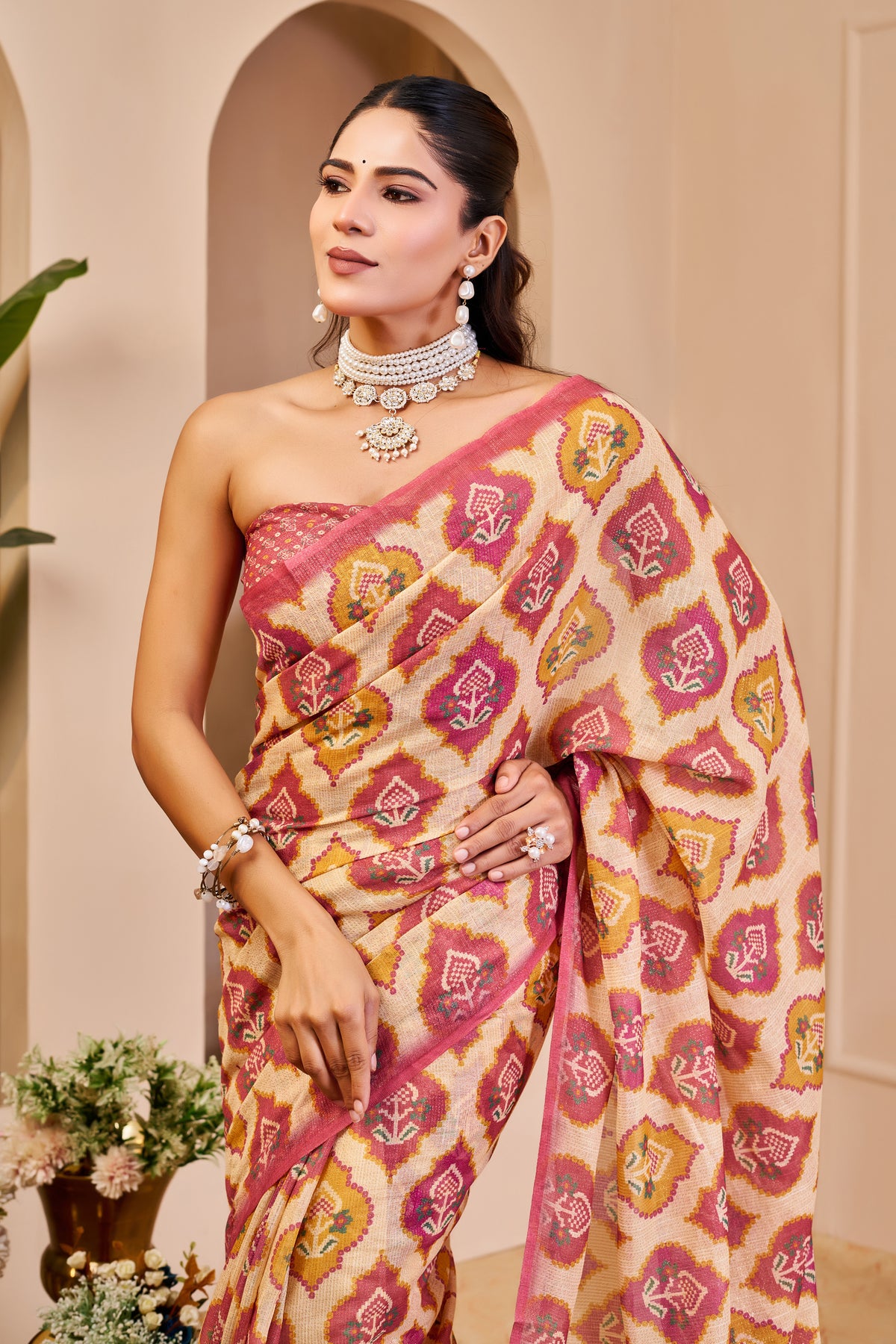 Cream and Rose Pink Tissue Silk Saree with Floral Motifs, Tasselled Pallu and Running Blouse for Festive Wear