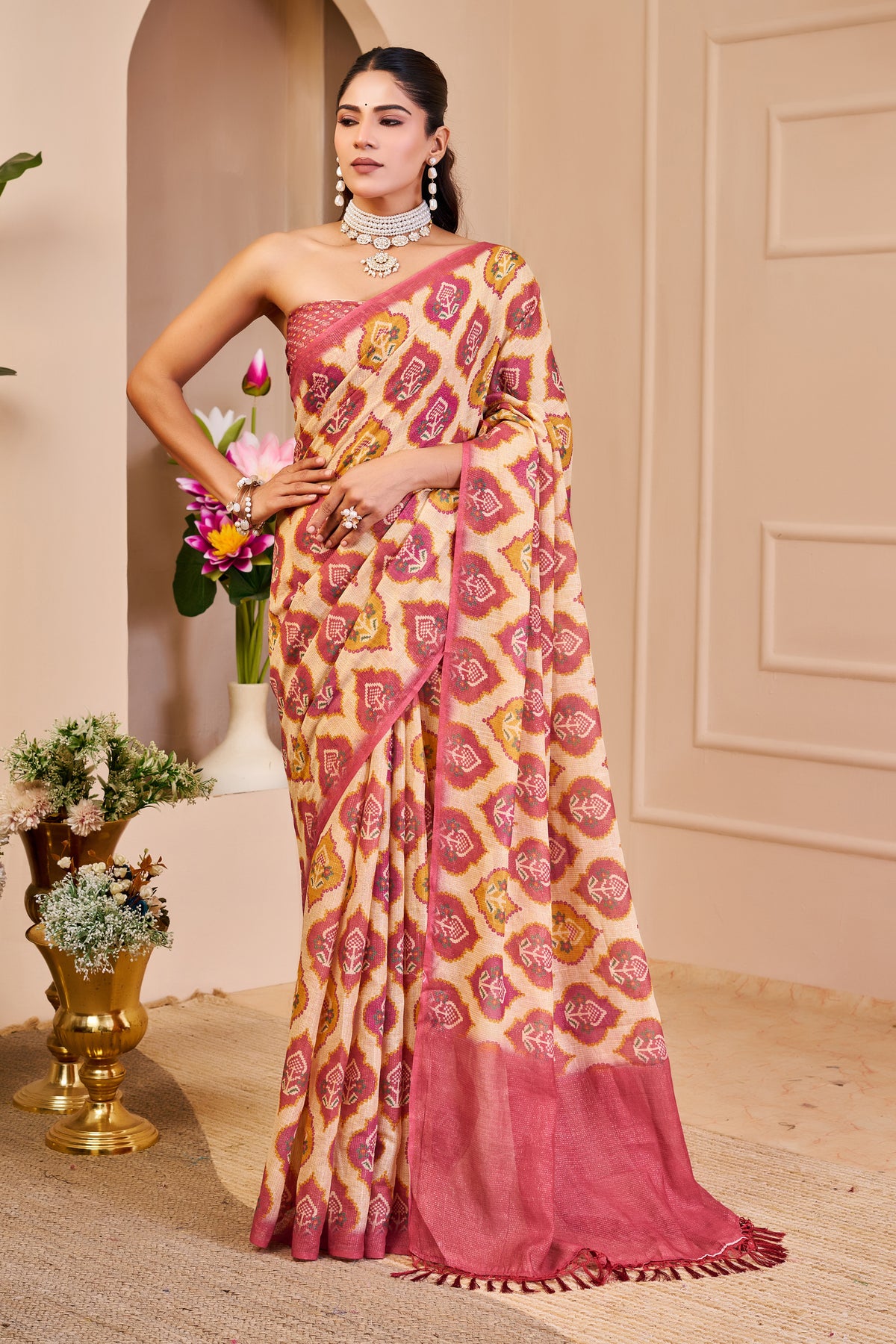 Cream and Rose Pink Tissue Silk Saree with Floral Motifs, Tasselled Pallu and Running Blouse for Festive Wear
