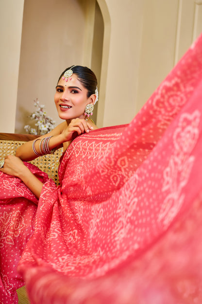 Coral Pink Tissue Silk Saree with Bandhani-Inspired Floral Motifs and Tasselled Pallu for Festive Wear with Running Blouse