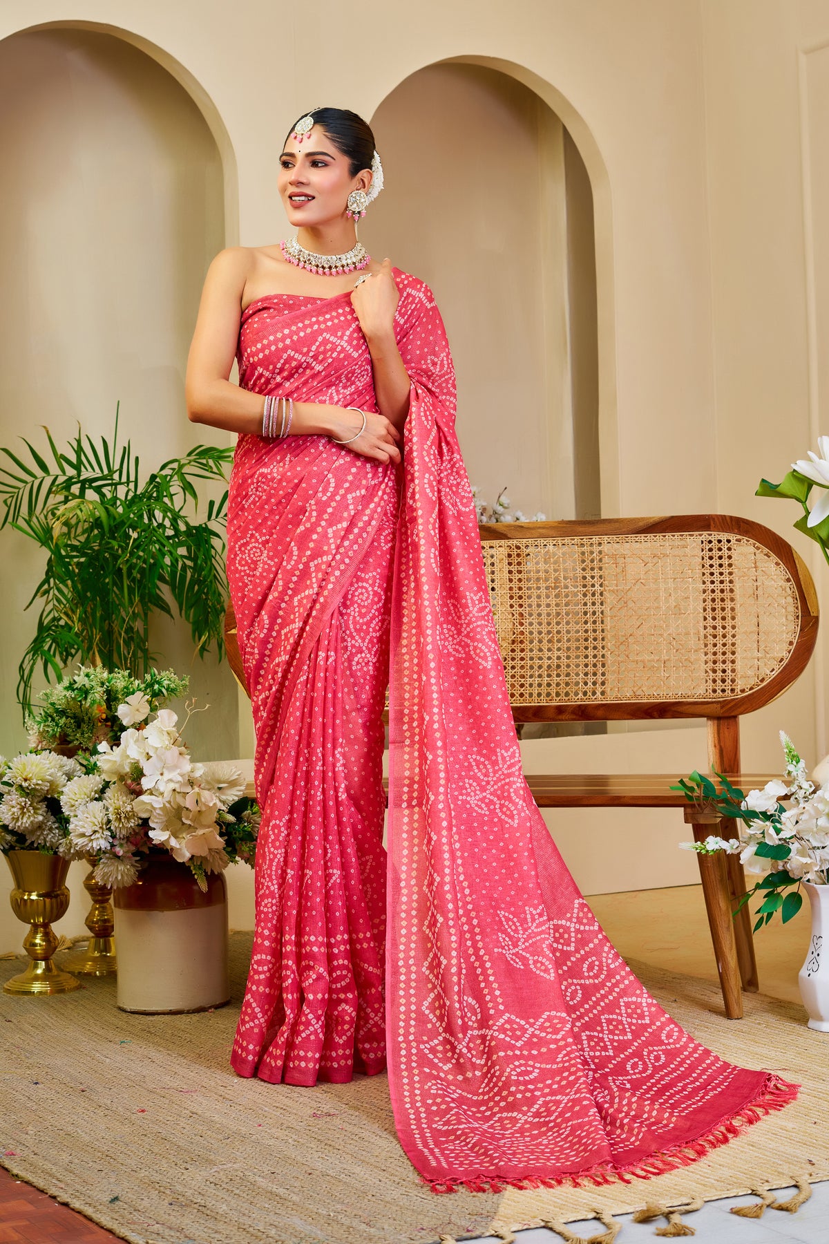 Coral Pink Tissue Silk Saree with Bandhani-Inspired Floral Motifs and Tasselled Pallu for Festive Wear with Running Blouse