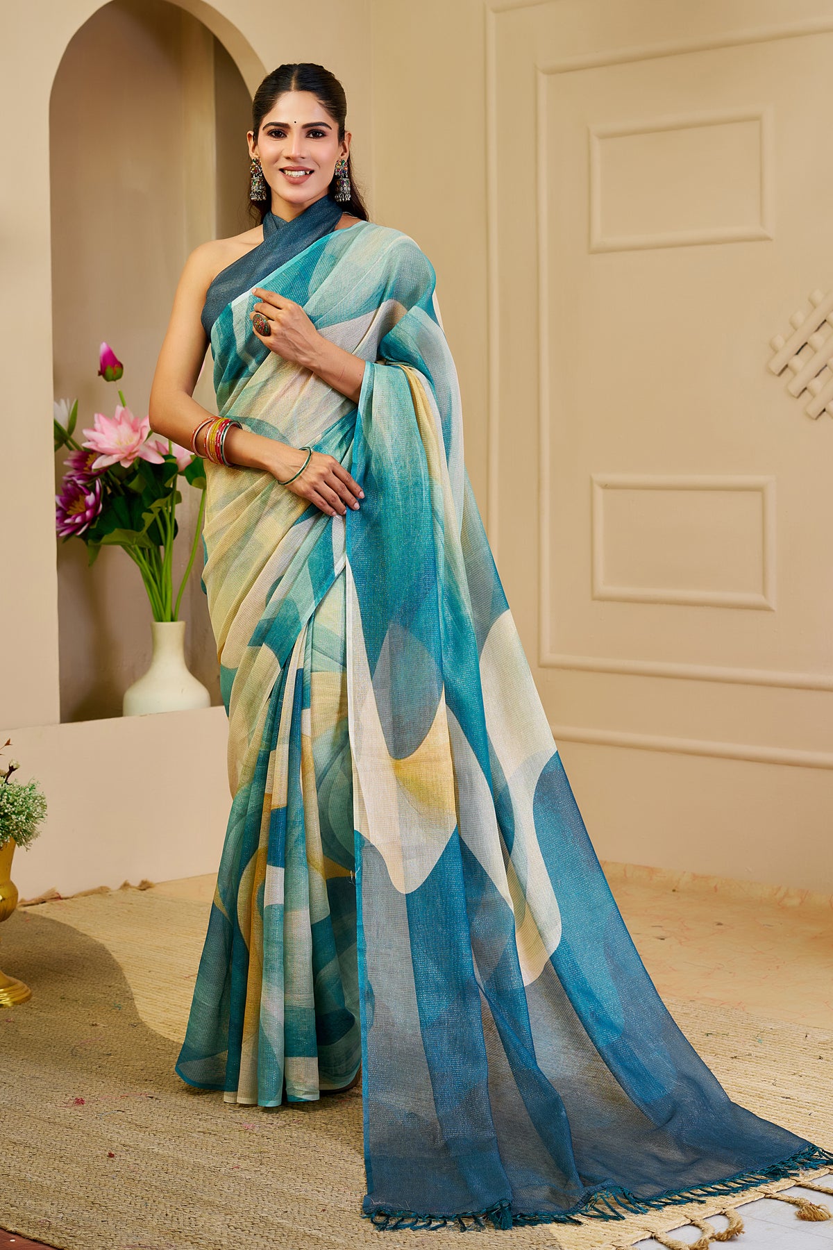 Teal Blue Tissue Silk Saree with Ivory Abstract Design, Tasselled Pallu and Running Blouse for Festive Occasions