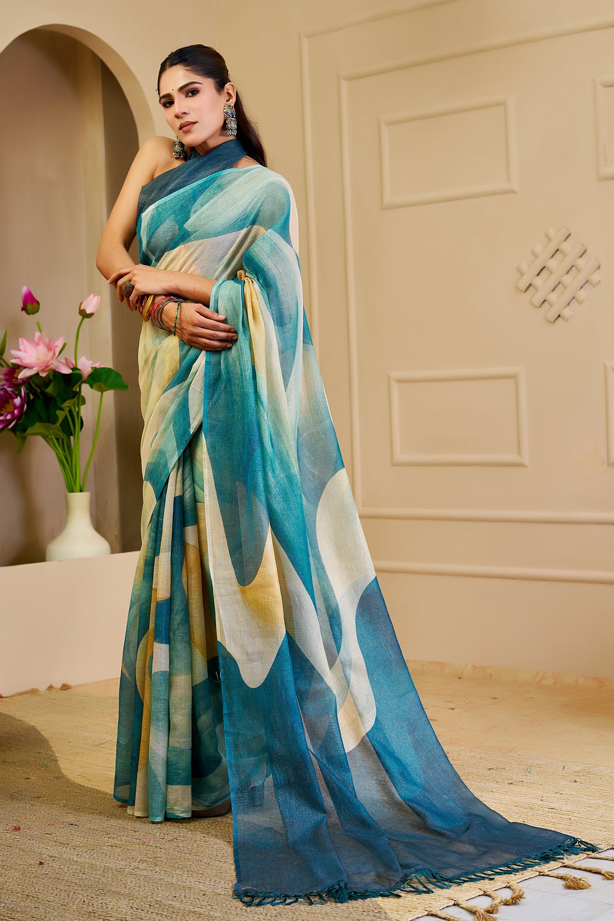 Teal Blue Tissue Silk Saree with Ivory Abstract Design, Tasselled Pallu and Running Blouse for Festive Occasions