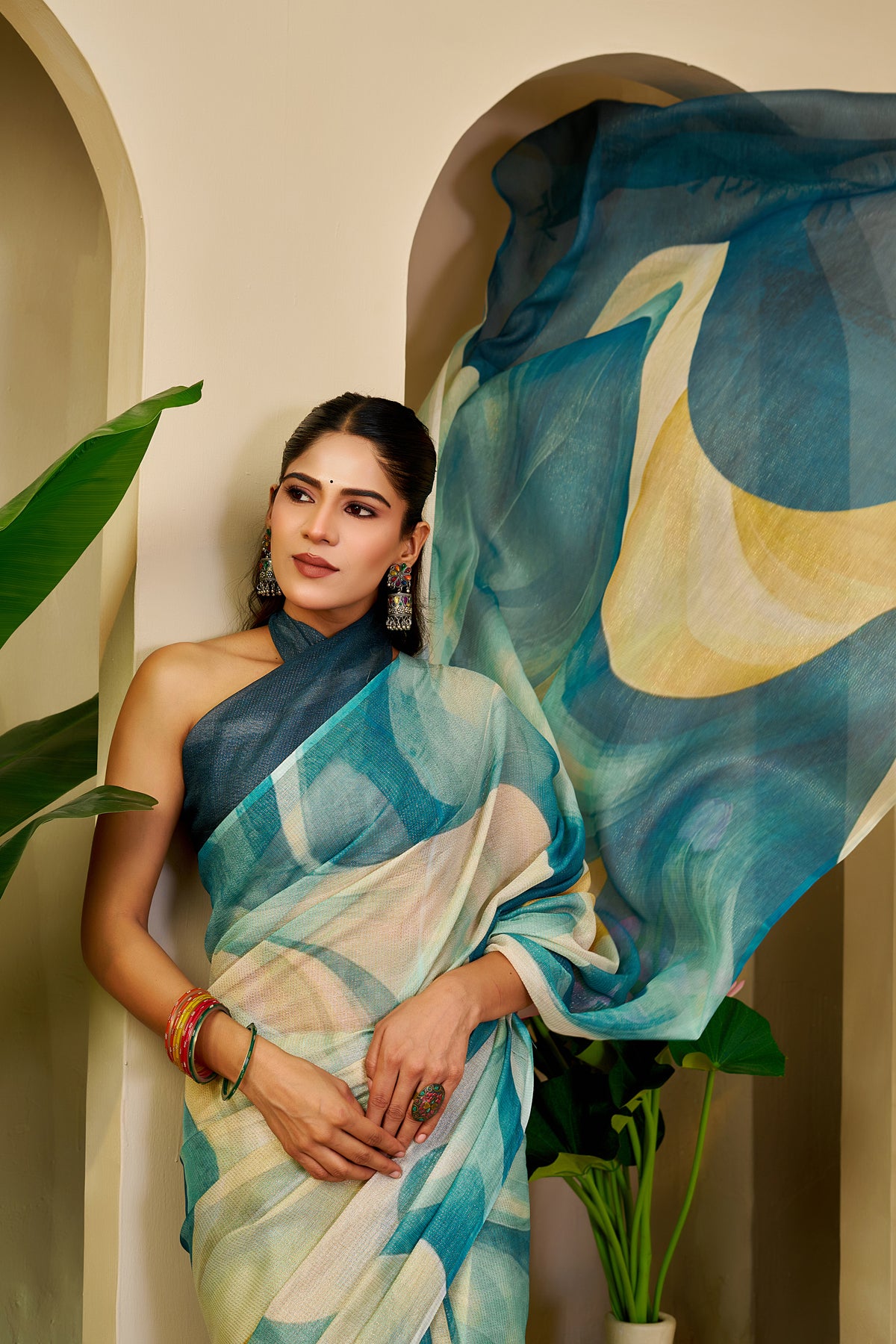 Teal Blue Tissue Silk Saree with Ivory Abstract Design, Tasselled Pallu and Running Blouse for Festive Occasions