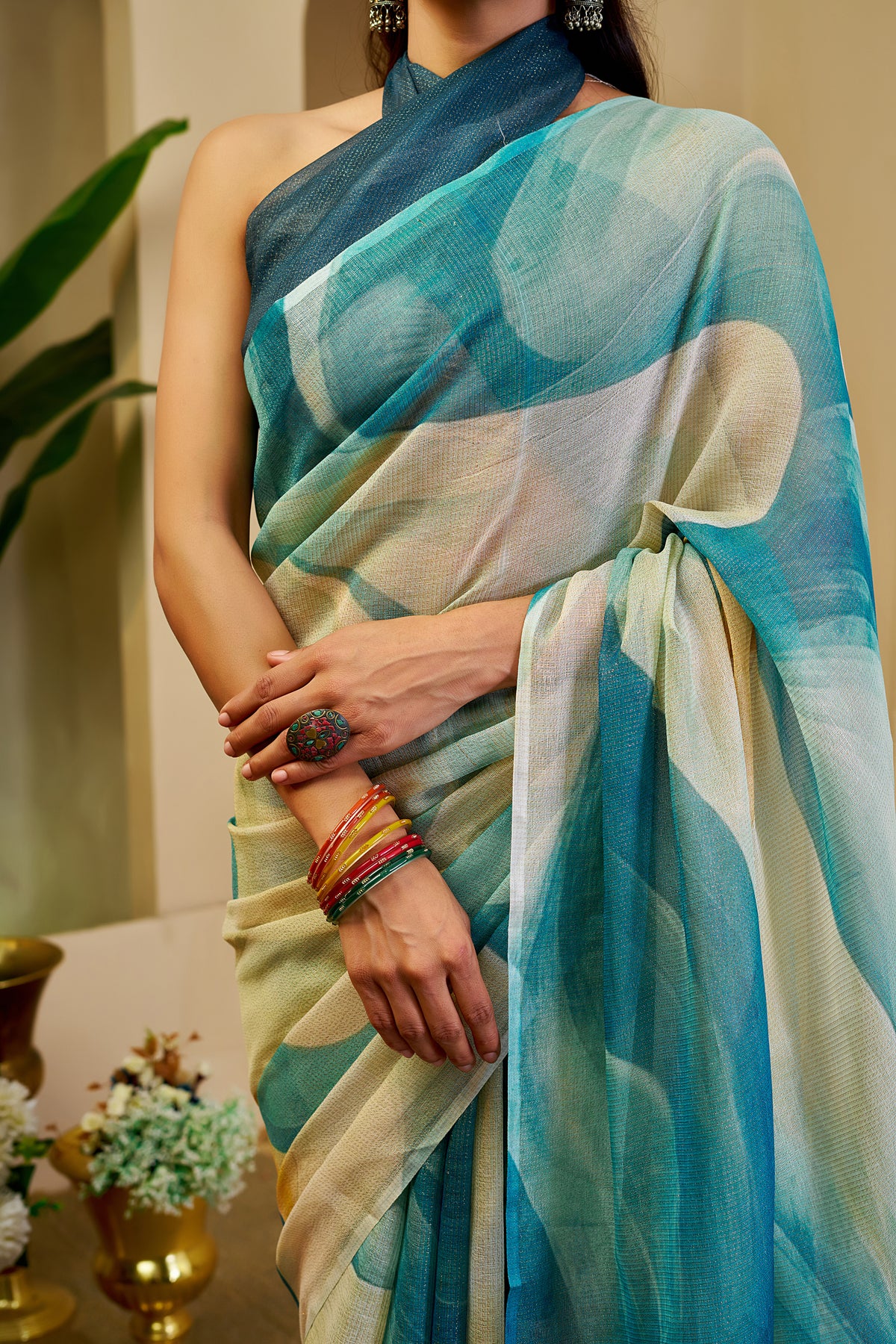 Teal Blue Tissue Silk Saree with Ivory Abstract Design, Tasselled Pallu and Running Blouse for Festive Occasions