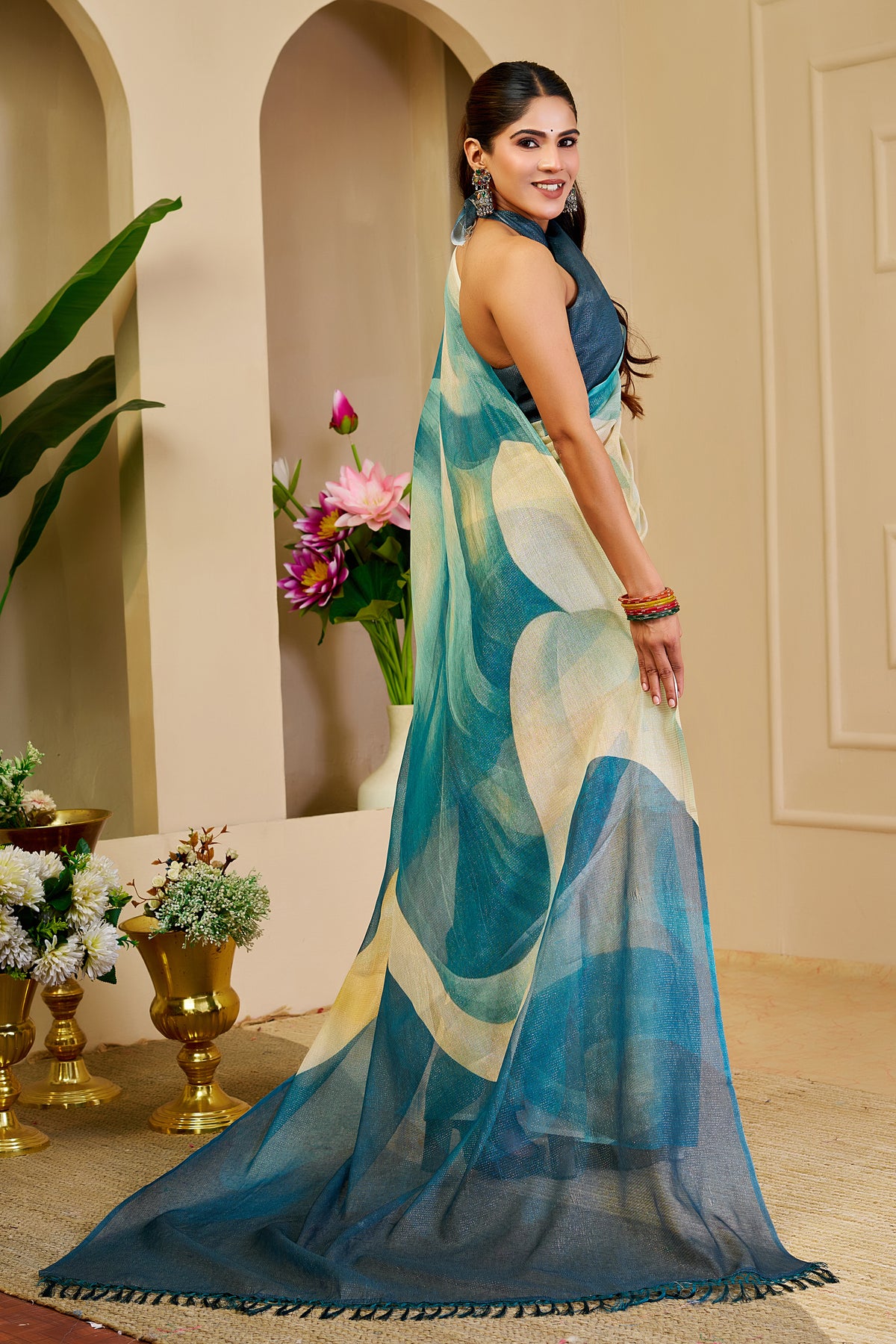 Teal Blue Tissue Silk Saree with Ivory Abstract Design, Tasselled Pallu and Running Blouse for Festive Occasions