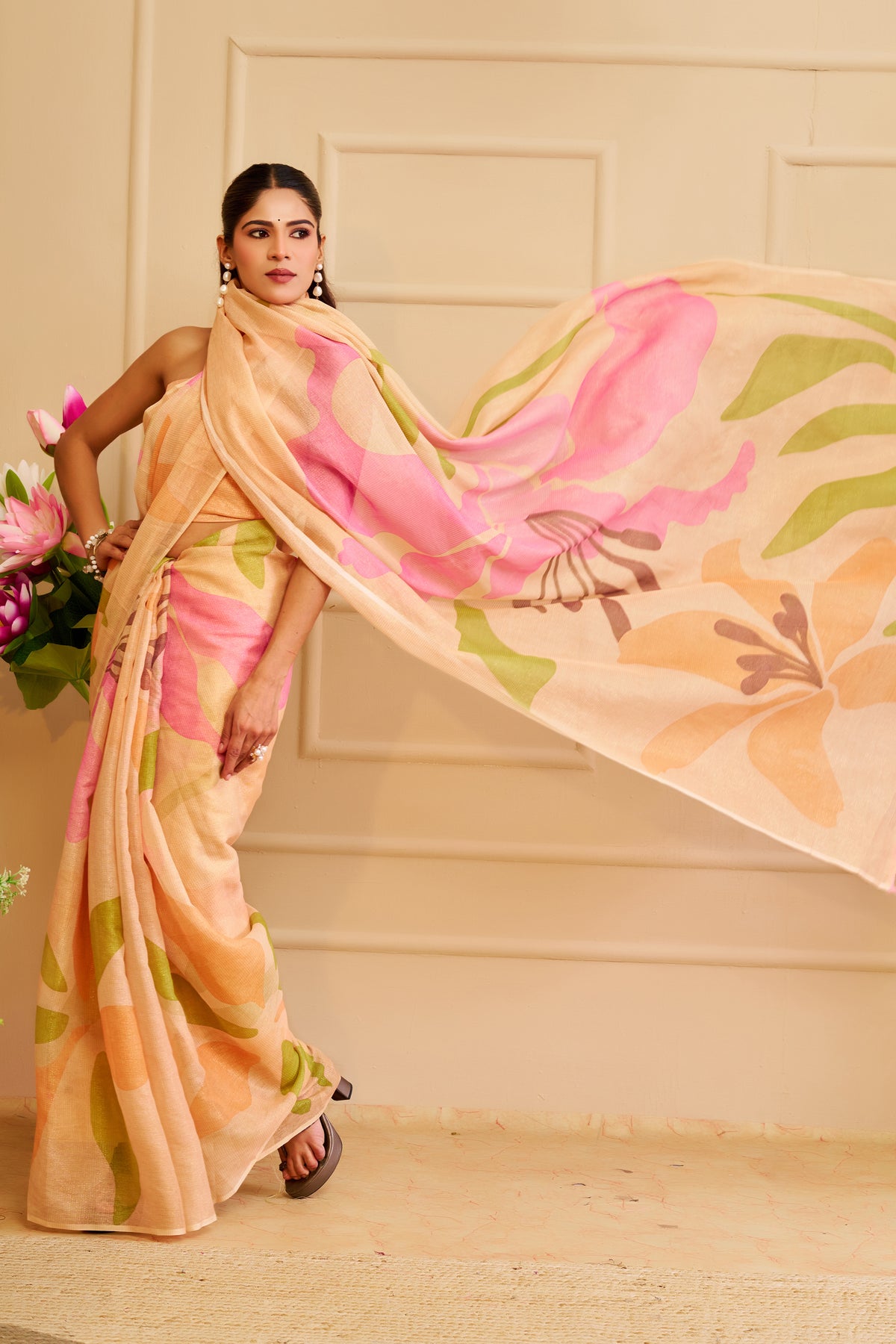 Peach Tissue Silk Saree with Pink and Green Floral Design, Tasselled Pallu and Running Blouse for Festive Wear