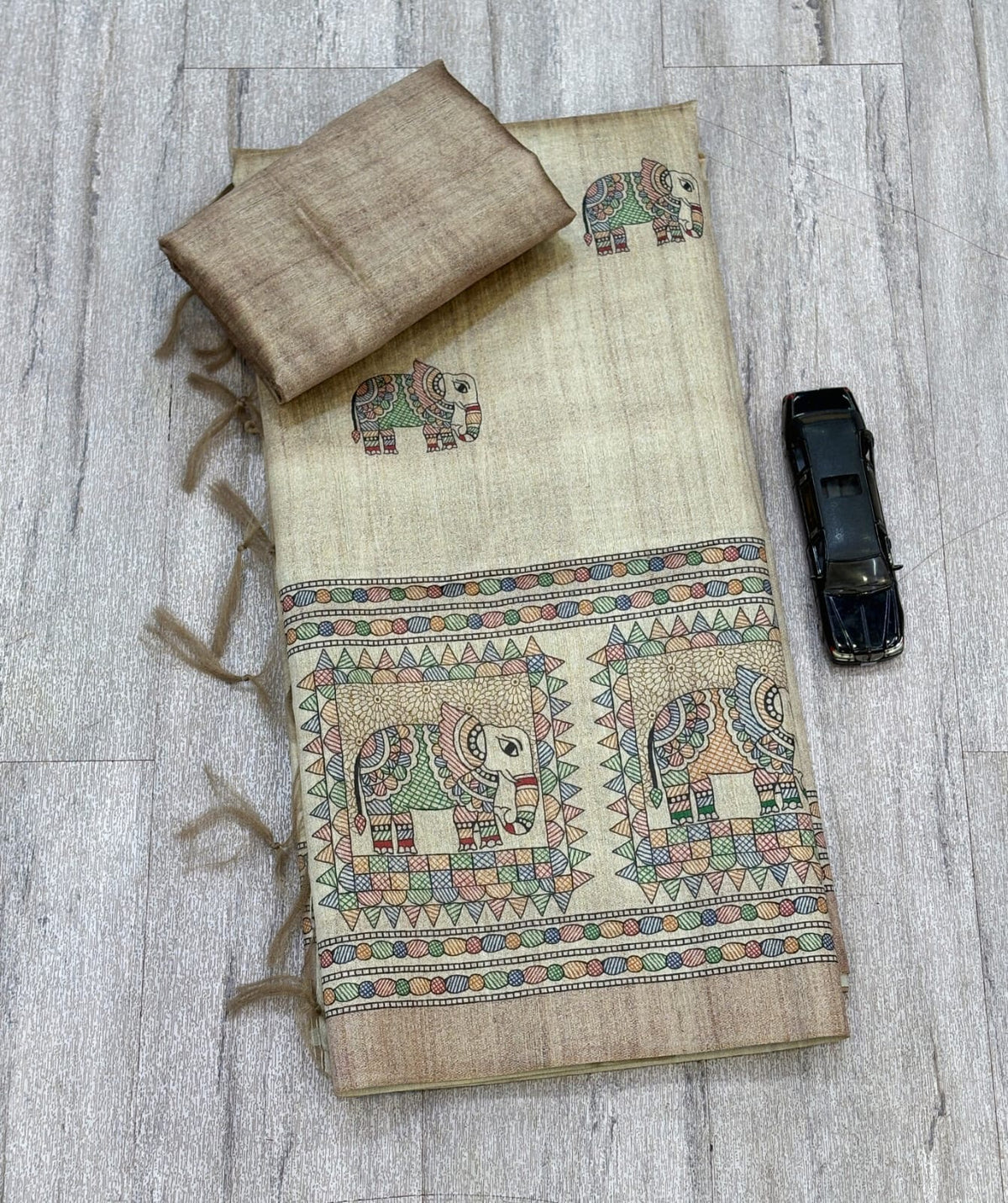 Cream Beige Silk Blend Saree with Multicolour Elephant Motifs, Decorative Pallu and Running Blouse for Festive Wear