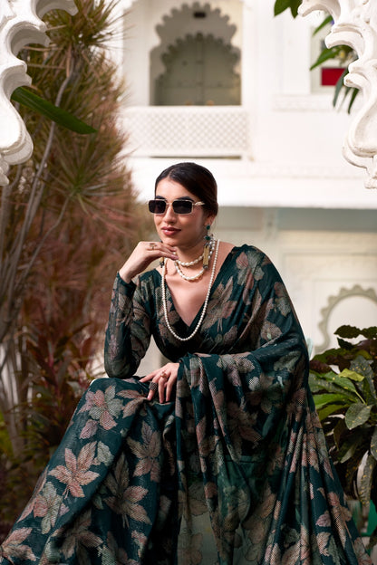 This floral Lurex Brasso saree blends the charm of blooming prints with the luxury of subtle shine