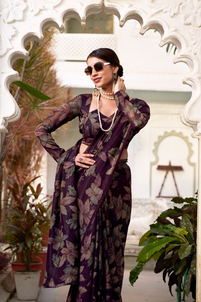 This floral Lurex Brasso saree blends the charm of blooming prints with the luxury of subtle shine