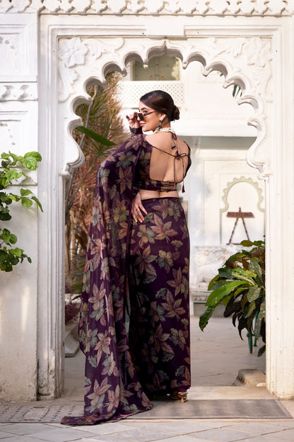 This floral Lurex Brasso saree blends the charm of blooming prints with the luxury of subtle shine