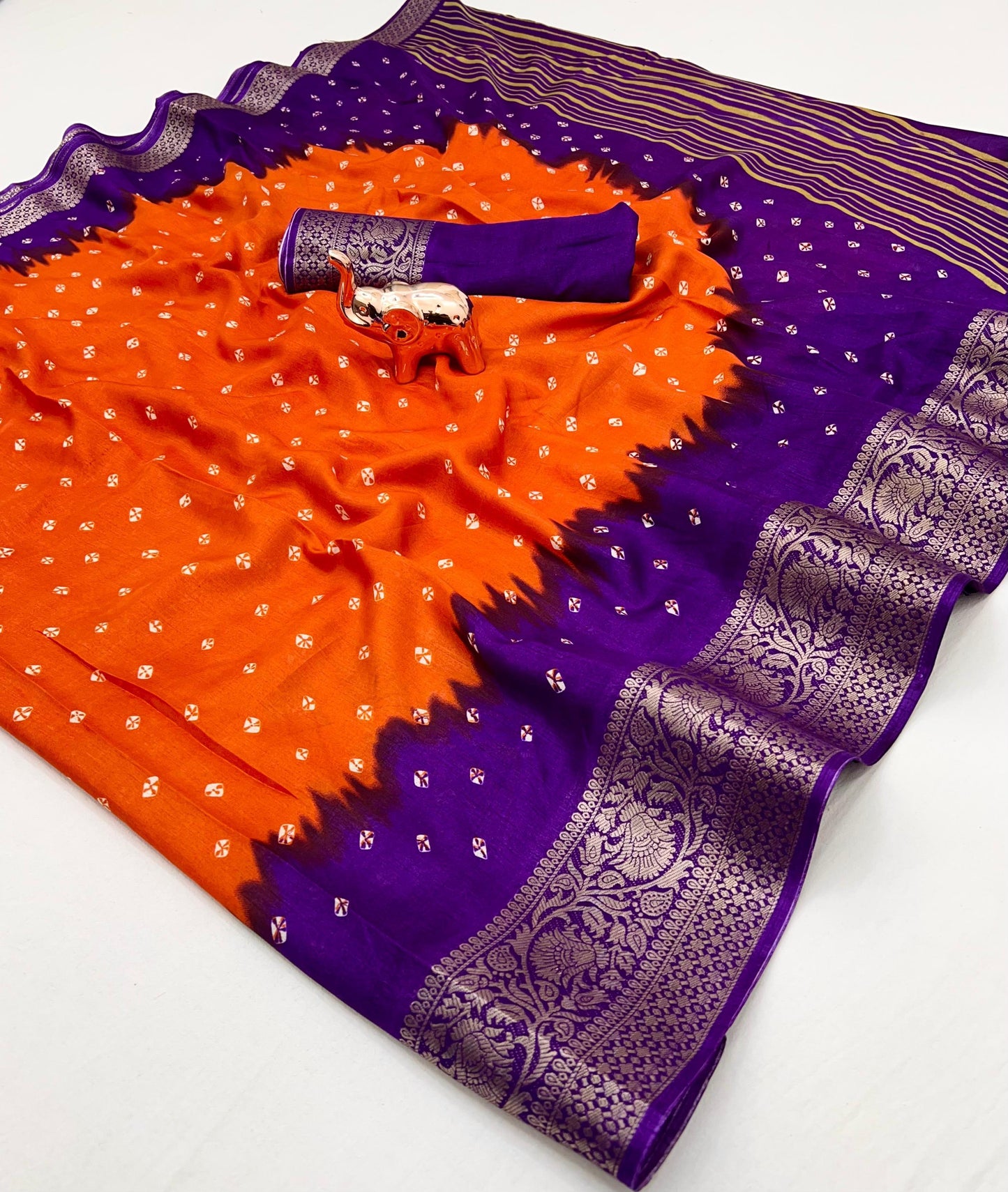 Soft dola silk saree with beauitful bandhini print and jacquard woven border