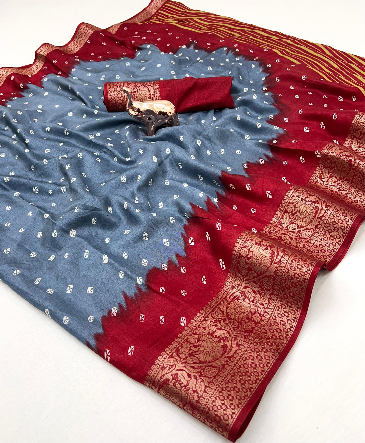 Soft dola silk saree with beauitful bandhini print and jacquard woven border