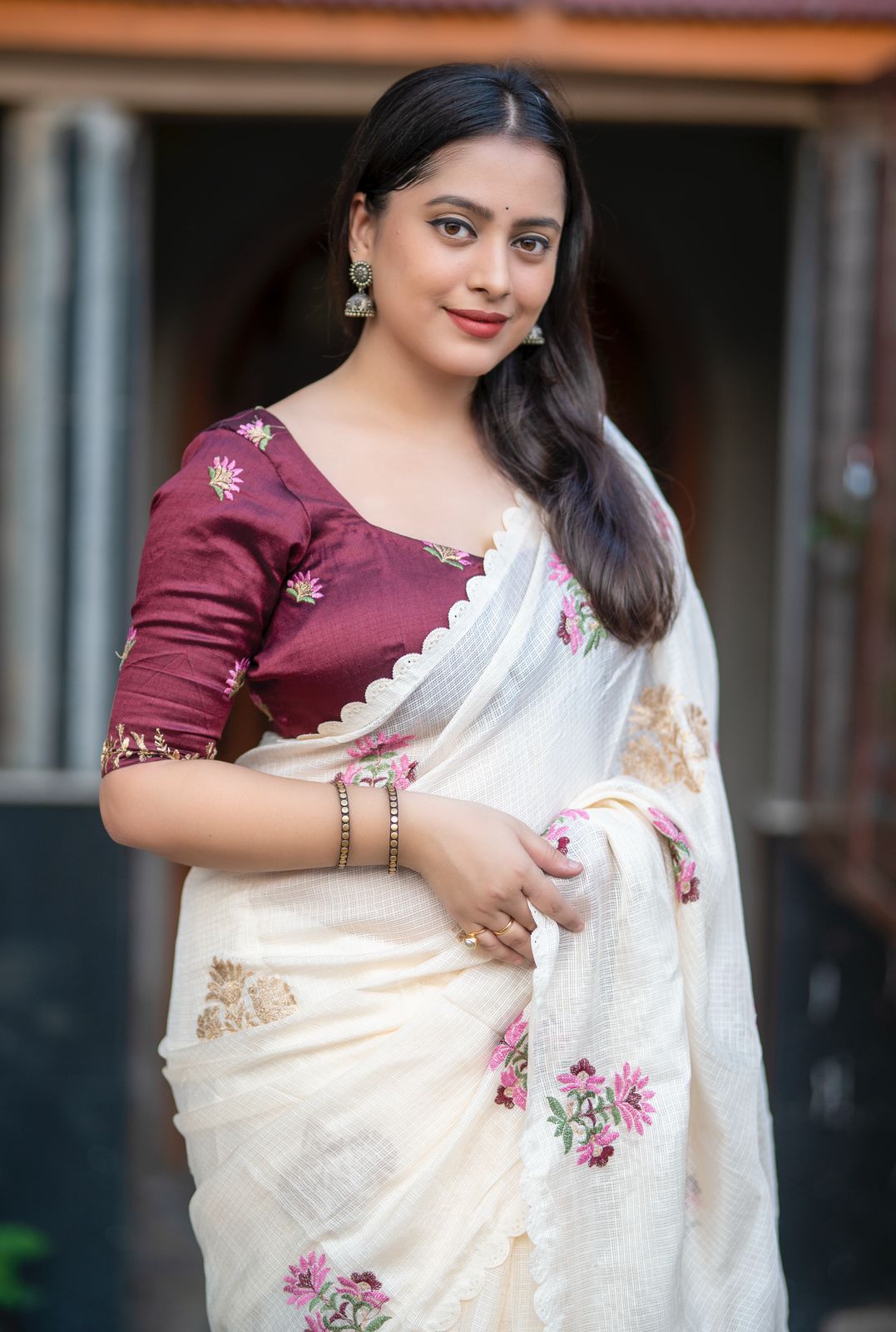 Ivory Kota saree fabric and blouse flat lay