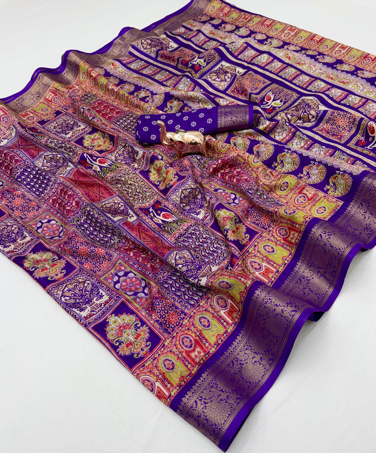 Purple Dola silk saree spread with multicolour panels and coordinating blouse