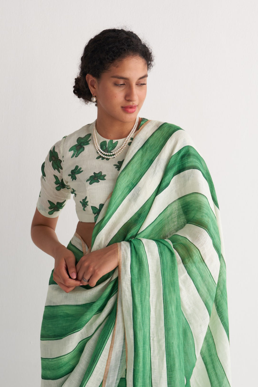 Emerald green and ivory striped linen saree - fabric close up