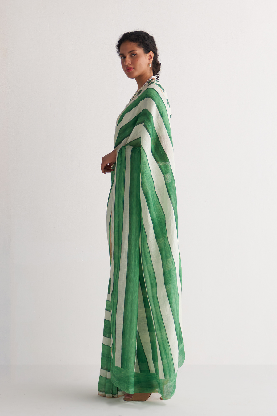 Emerald green and ivory striped linen saree - front view