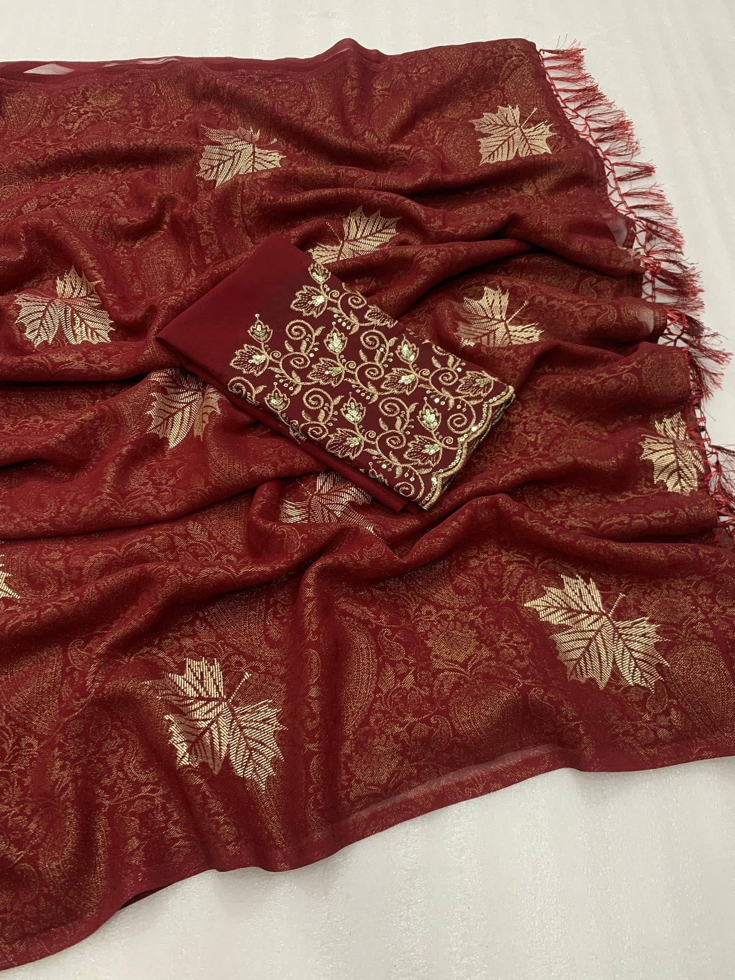 Georgette fabric with additional smoke work with beautiful leather foil with heavy tone to tone embroidary work blouse