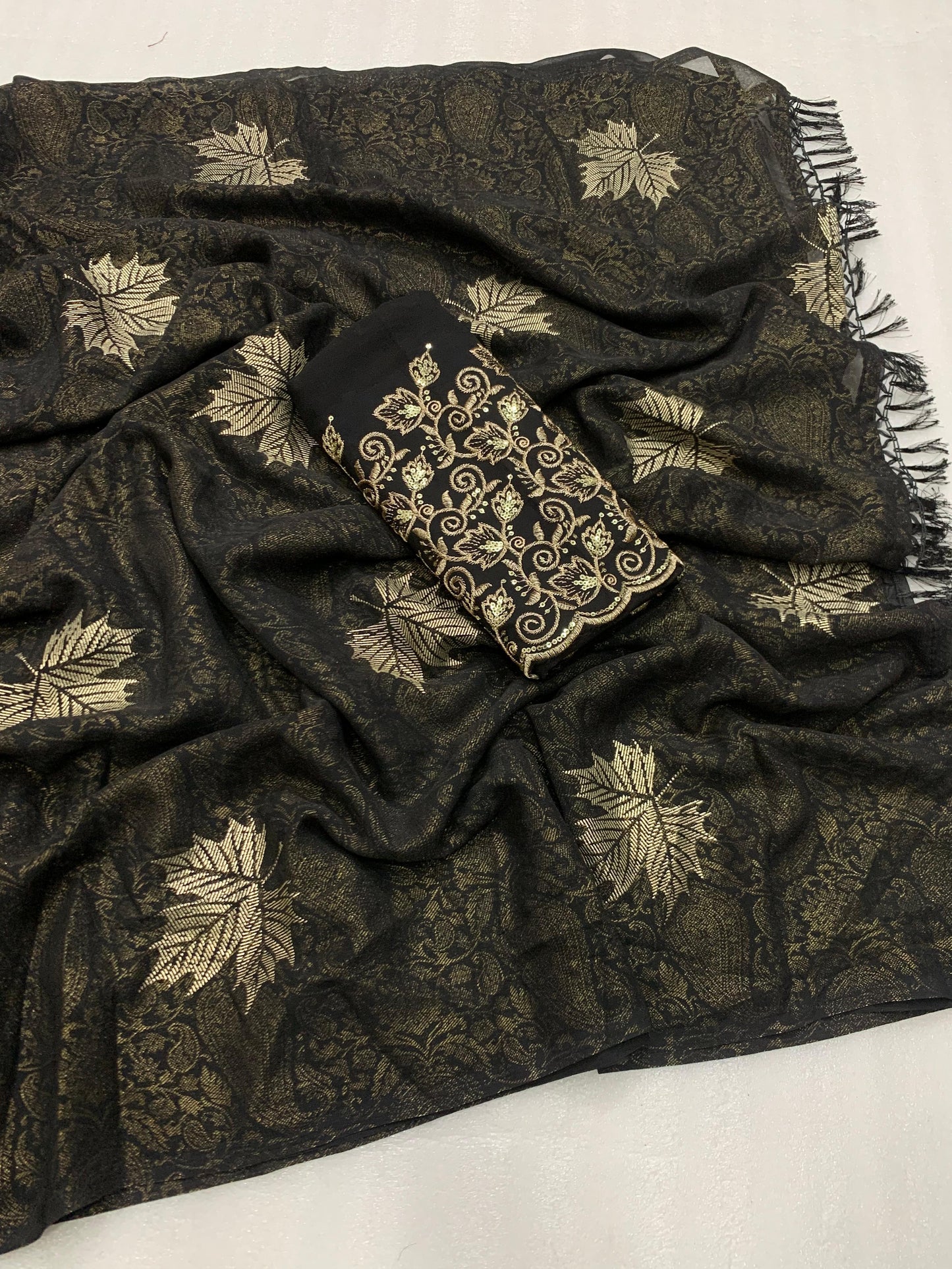 Georgette fabric with additional smoke work with beautiful leather foil with heavy tone to tone embroidary work blouse