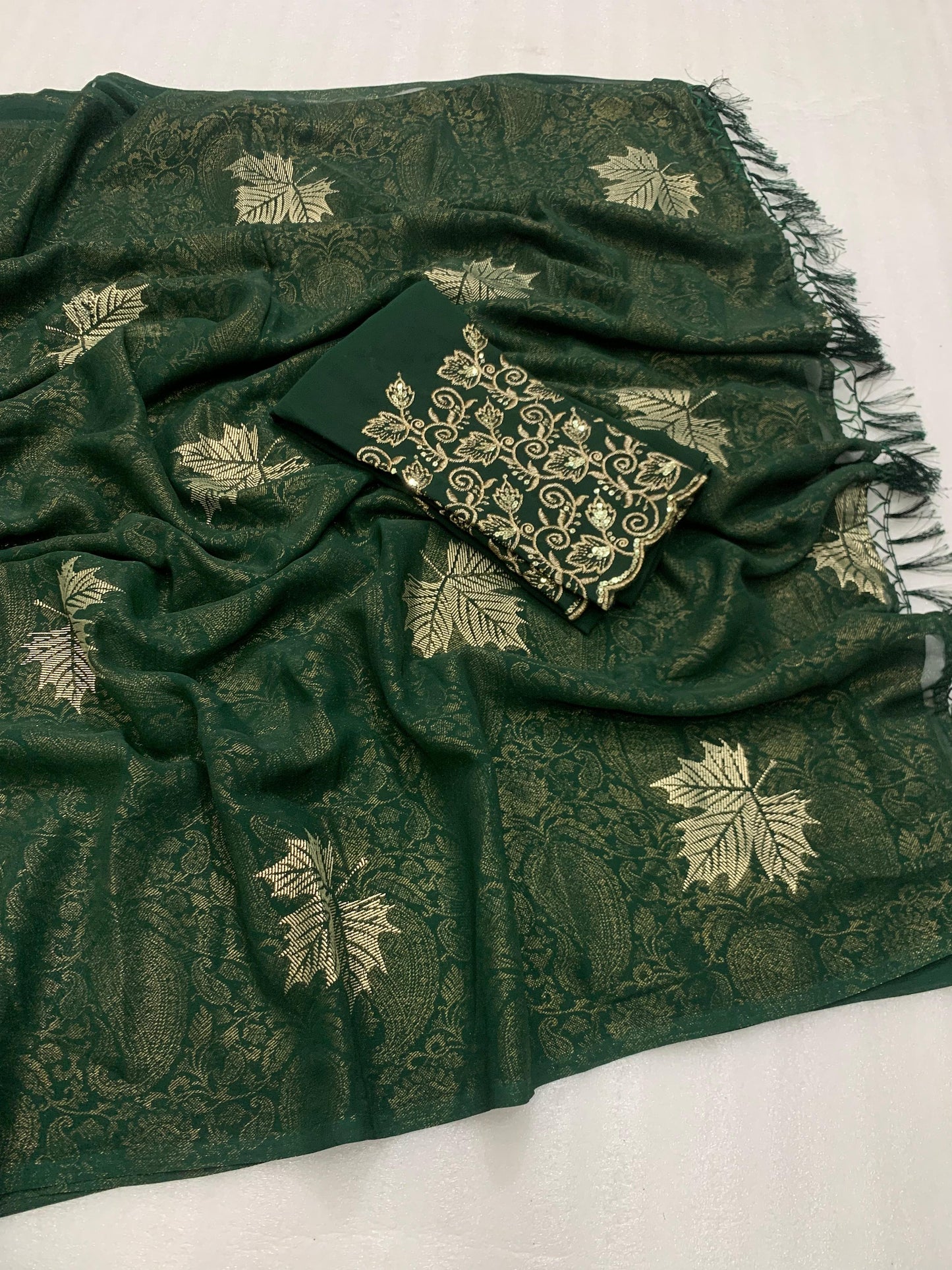 Georgette fabric with additional smoke work with beautiful leather foil with heavy tone to tone embroidary work blouse