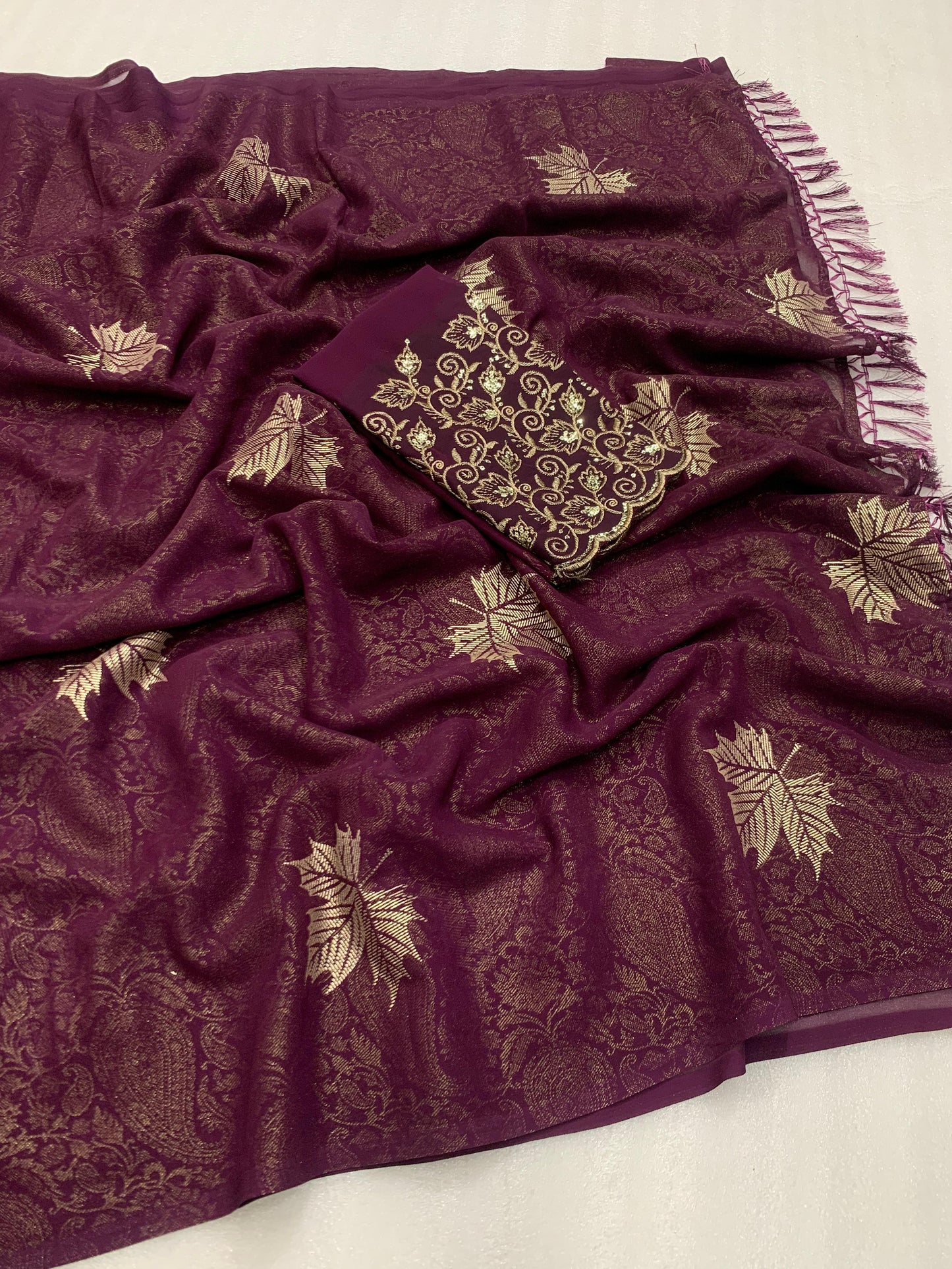 Georgette fabric with additional smoke work with beautiful leather foil with heavy tone to tone embroidary work blouse