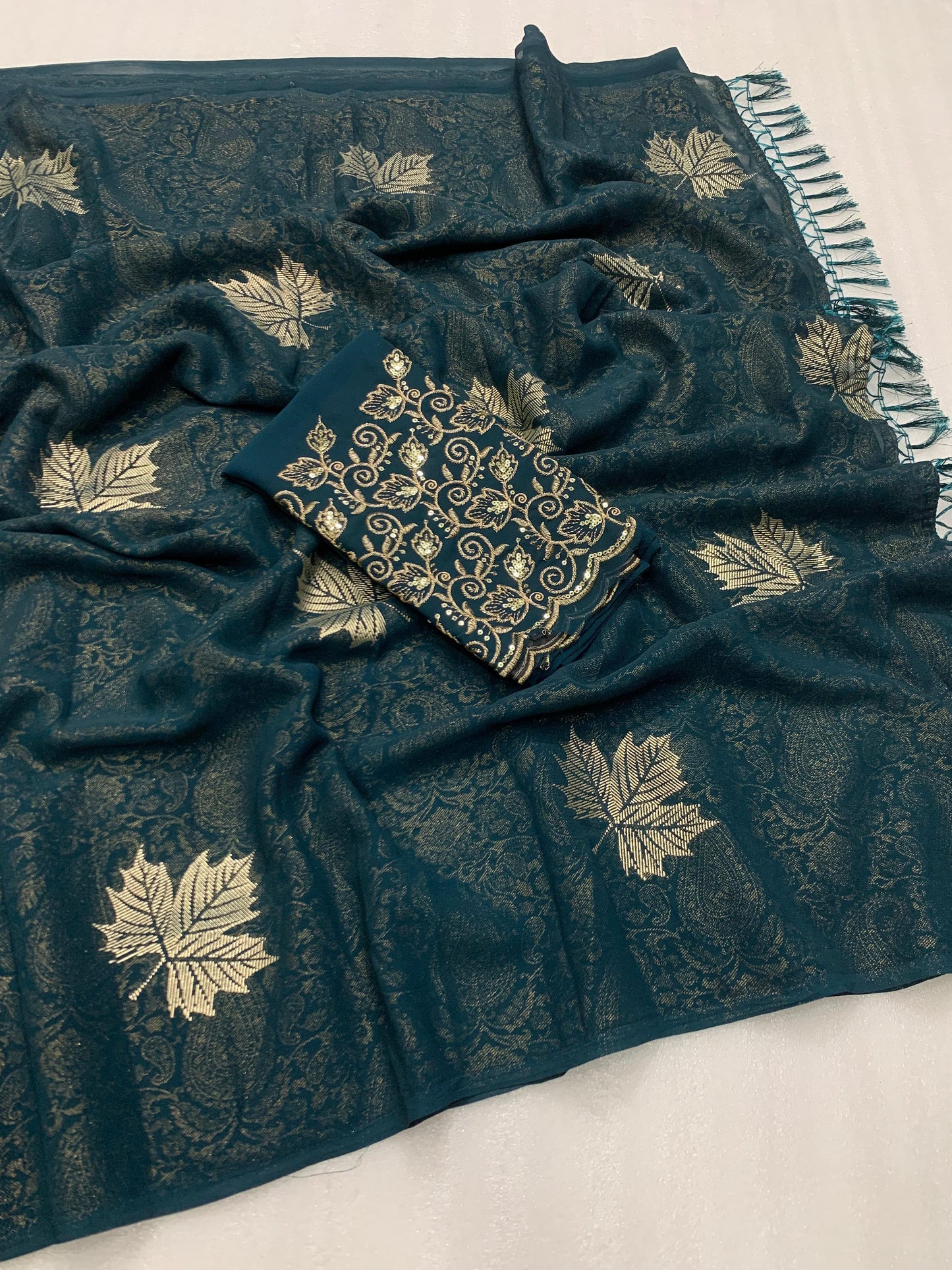 Georgette fabric with additional smoke work with beautiful leather foil with heavy tone to tone embroidary work blouse