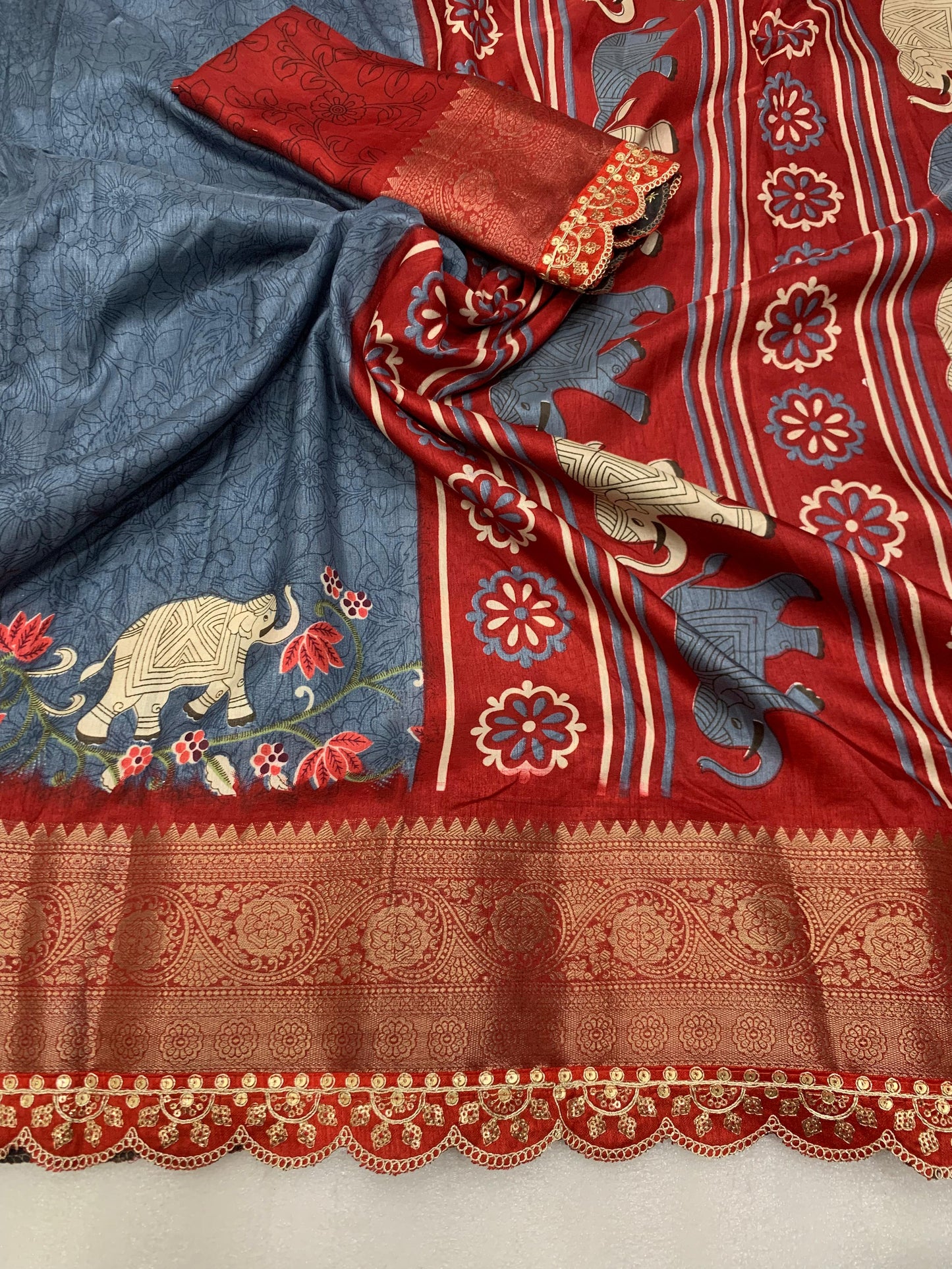 Beautiful Benny crape saree with all over kalamkari design along with scallop maggam work lace at border