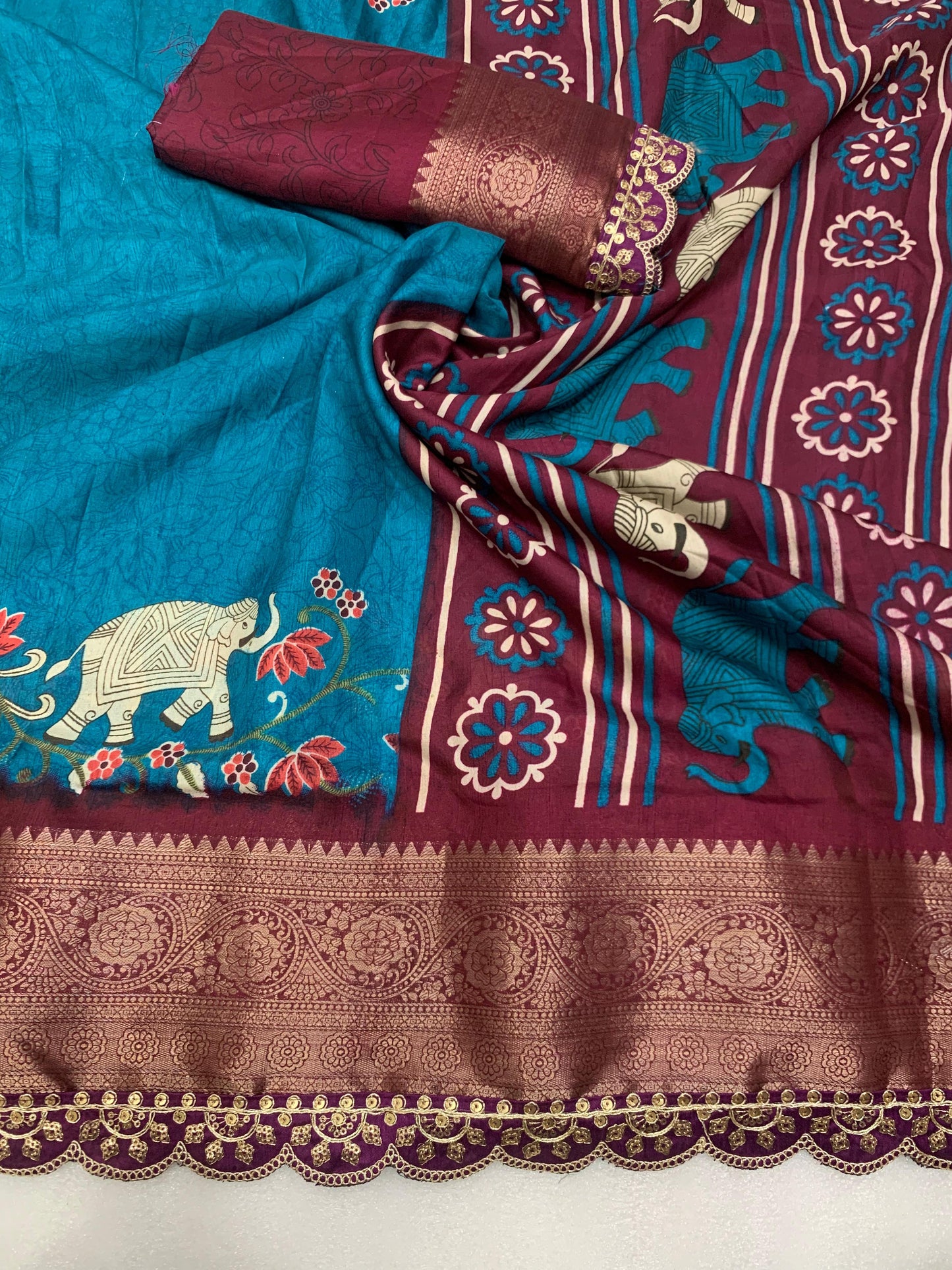 Beautiful Benny crape saree with all over kalamkari design along with scallop maggam work lace at border