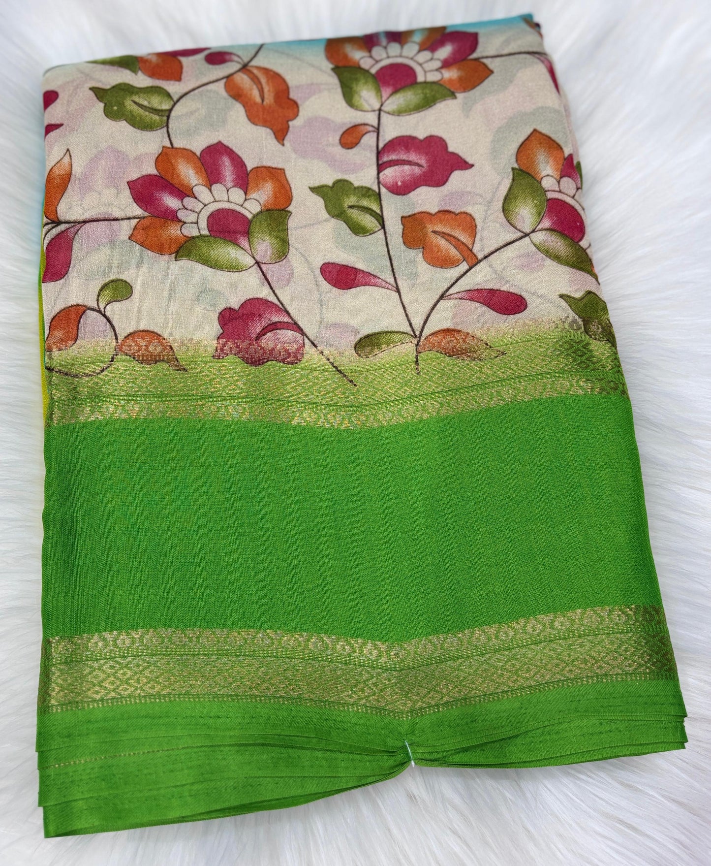 Soft Georgette saree with beautiful floral prints and heavy zari bentex border.