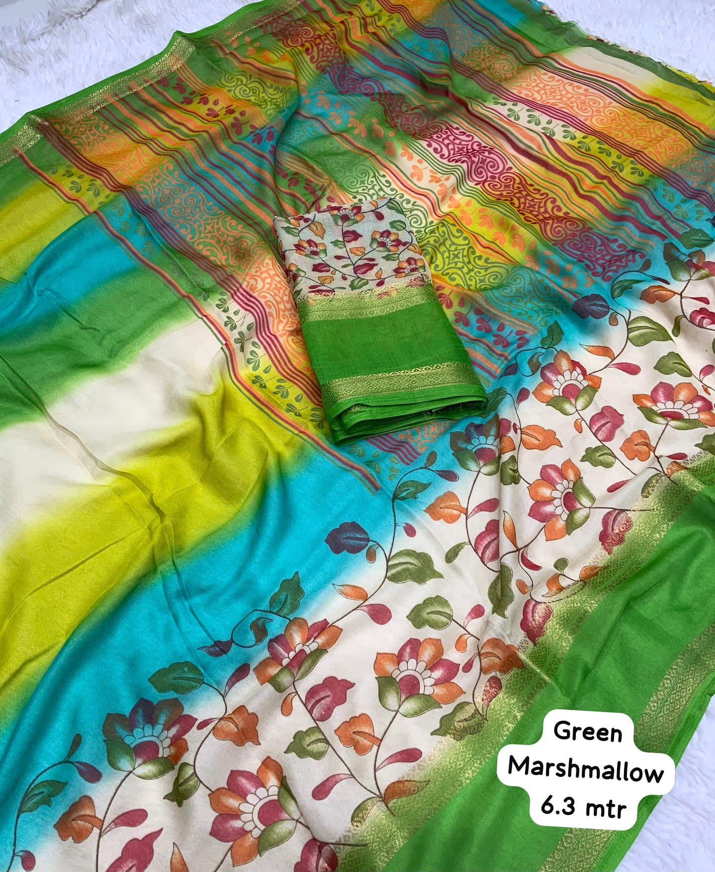 Soft Georgette saree with beautiful floral prints and heavy zari bentex border.