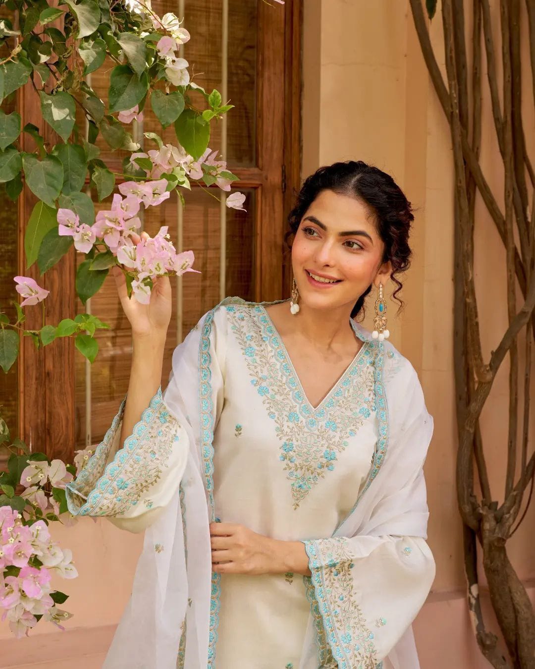 beautiful Heavy Suit Set which is beautifully decorated with intricate hand embroidery, It is paired with matching Sharara and embroidery Lace with sequence dupatta Lace.