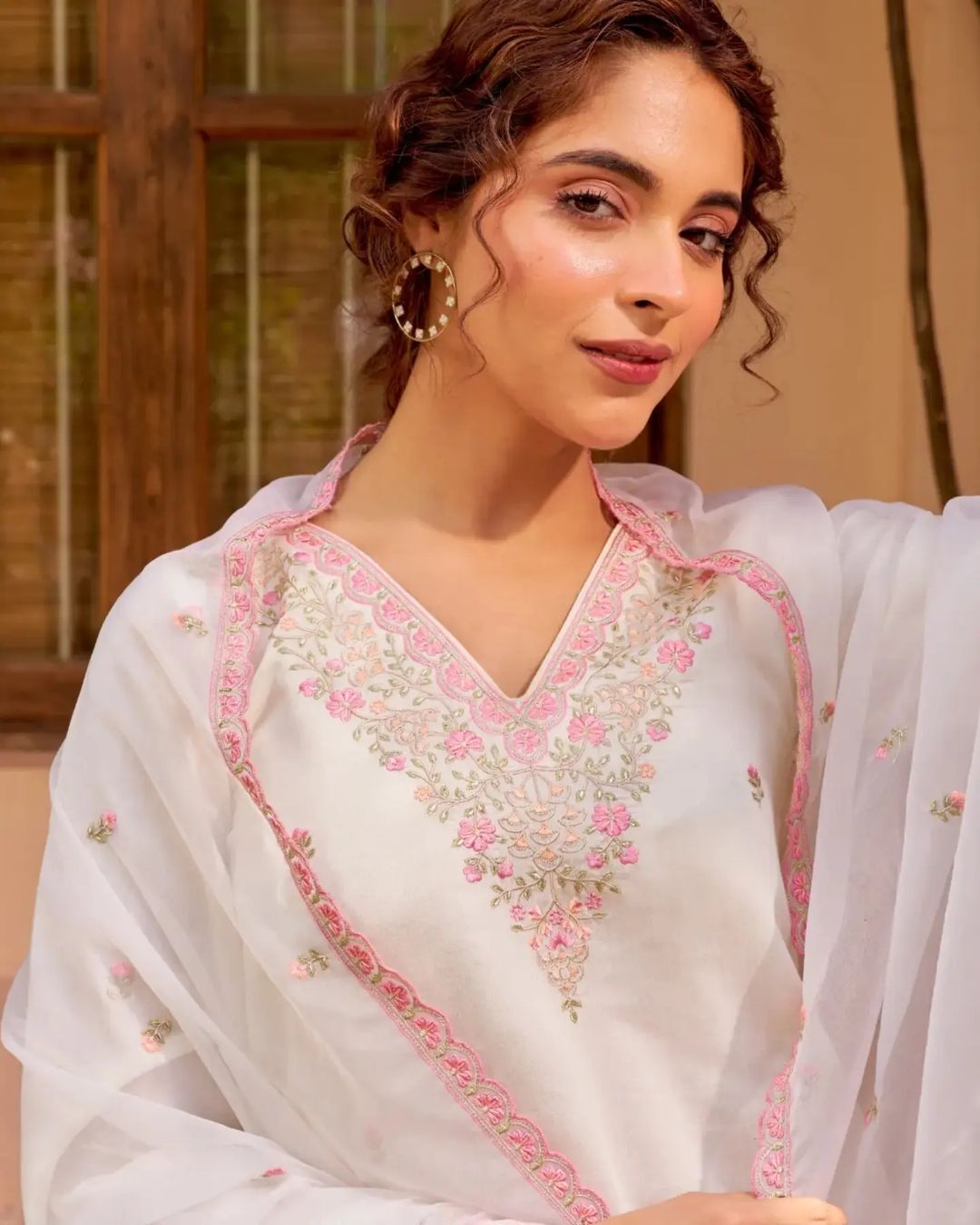 beautiful Heavy Suit Set which is beautifully decorated with intricate hand embroidery, It is paired with matching Sharara and embroidery Lace with sequence dupatta Lace.