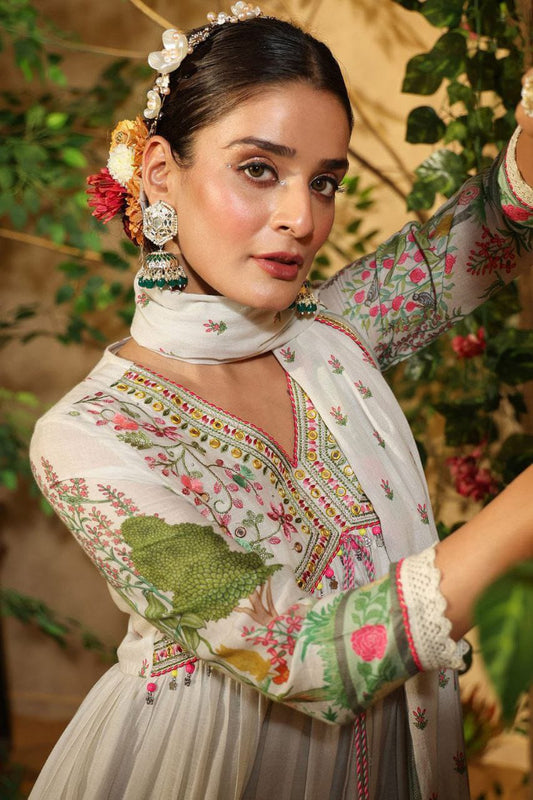 Featuring beautiful MUSLIN ALIA CUT Suit Set which is beautifully decorated with intricate hand embroidery, Zari weaving and prints. It is paired with matching pants and lace dupatta | White - Swaraas