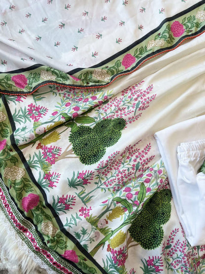 Featuring beautiful MUSLIN ALIA CUT Suit Set which is beautifully decorated with intricate hand embroidery, Zari weaving and prints. It is paired with matching pants and lace dupatta | White - Swaraas