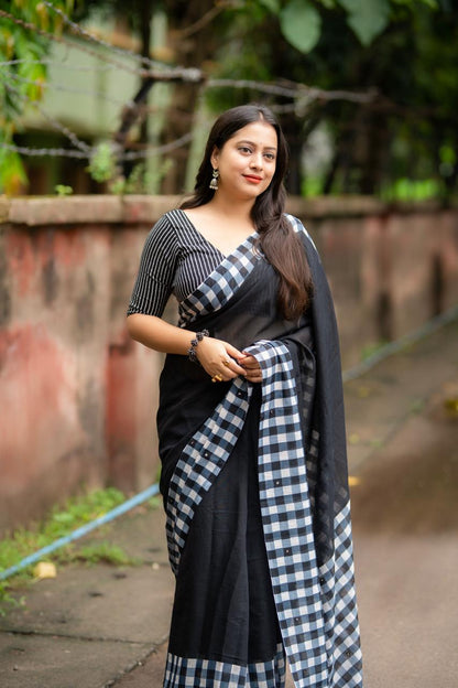 Black linen saree flat lay - fabric detail